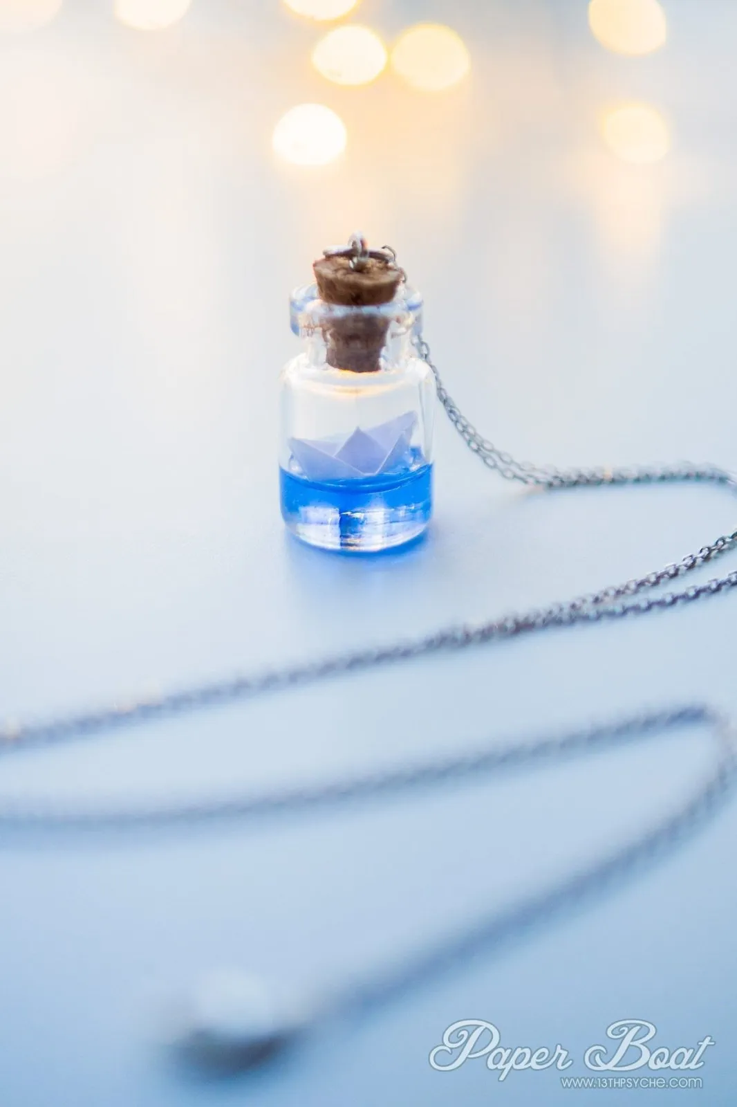 Sterling silver paper boat bottle necklace